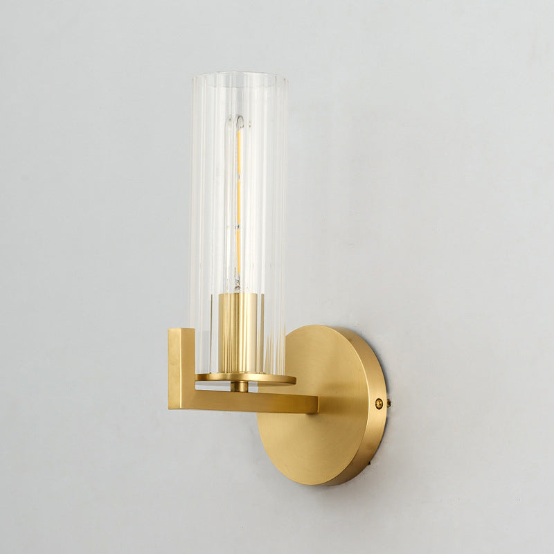 Brass Cylinder Wall Light Sconce Post Modern 1 Head Clear Glass Wall Mount Lamp for Bedside Clearhalo 'Cast Iron' 'Glass' 'Industrial' 'Modern wall lights' 'Modern' 'Tiffany' 'Traditional wall lights' 'Wall Lamps & Sconces' 'Wall Lights' Lighting' 520679