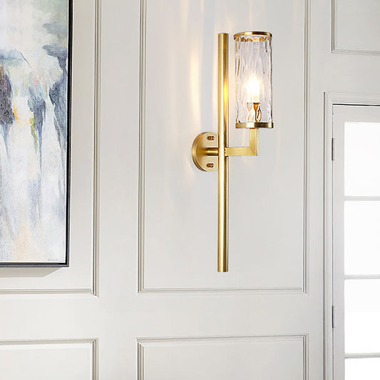 Modernist Cylinder Sconce Light Fixture Clear Water Glass 1 Light Corner Wall Lamp in Brass with Pencil Arm Brass Clearhalo 'Cast Iron' 'Glass' 'Industrial' 'Modern wall lights' 'Modern' 'Tiffany' 'Traditional wall lights' 'Wall Lamps & Sconces' 'Wall Lights' Lighting' 520681