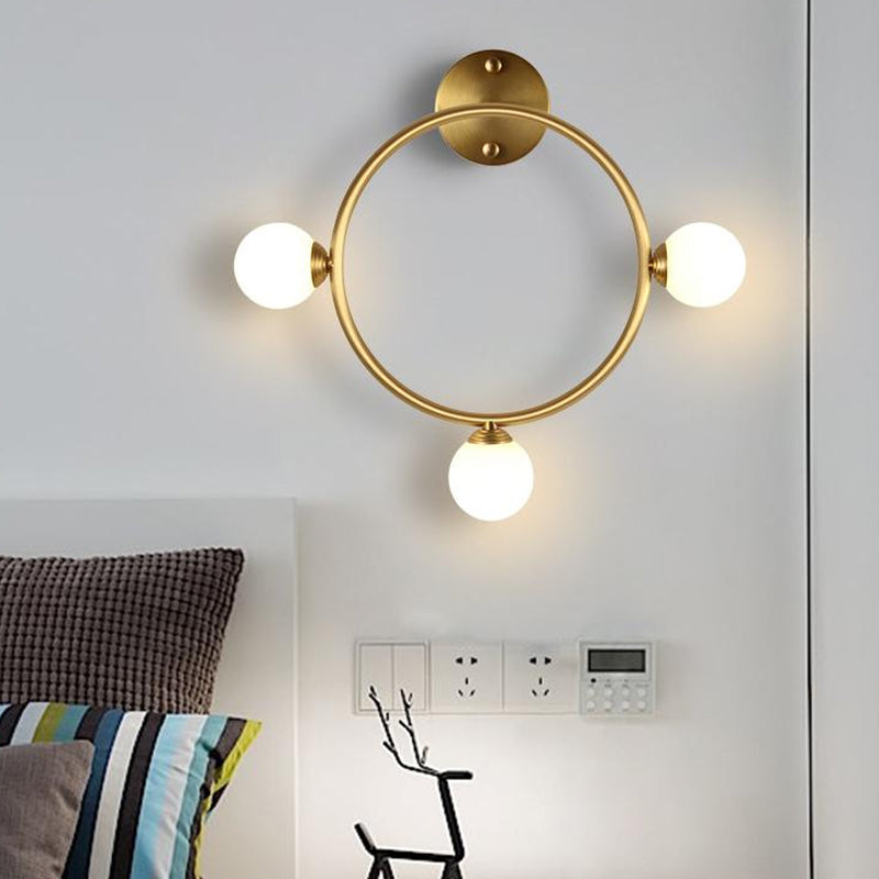 Metallic Ring Wall Mount Sconce Post-Modern 3 Lights LED Wall Lamp Fixture in Brass for Bedside Clearhalo 'Cast Iron' 'Glass' 'Industrial' 'Modern wall lights' 'Modern' 'Tiffany' 'Traditional wall lights' 'Wall Lamps & Sconces' 'Wall Lights' Lighting' 520717