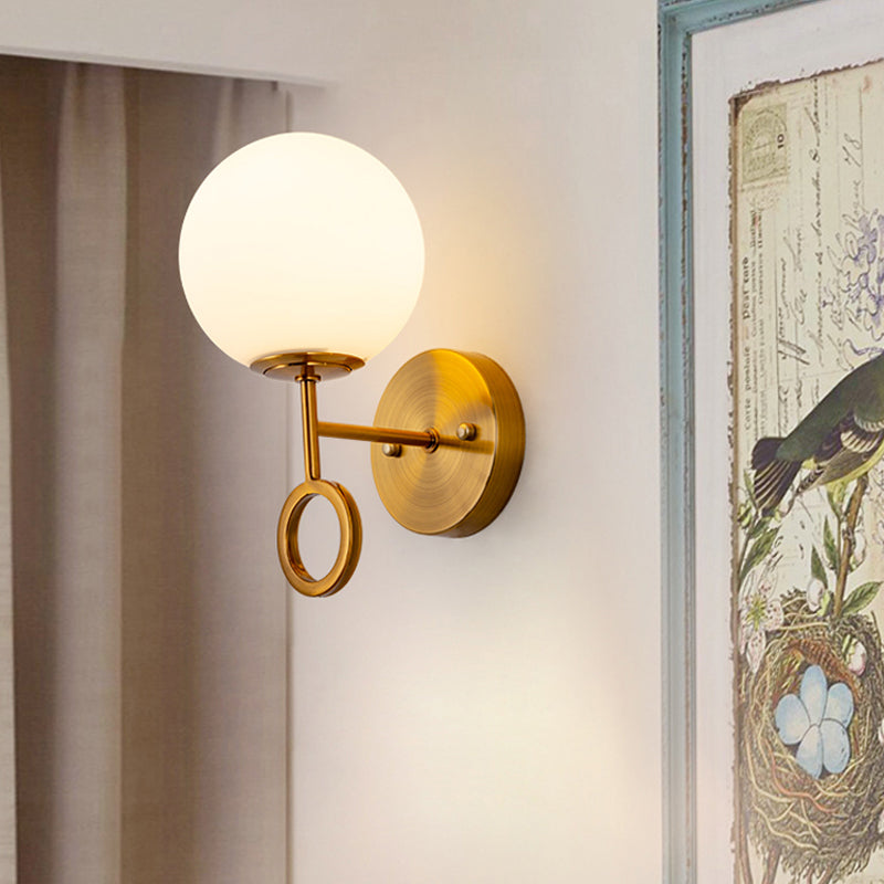 Minimalist 1 Light Sconce Lighting with Cream Glass Shade Brass Global Wall Mounted Lamp Clearhalo 'Cast Iron' 'Glass' 'Industrial' 'Modern wall lights' 'Modern' 'Tiffany' 'Traditional wall lights' 'Wall Lamps & Sconces' 'Wall Lights' Lighting' 520722