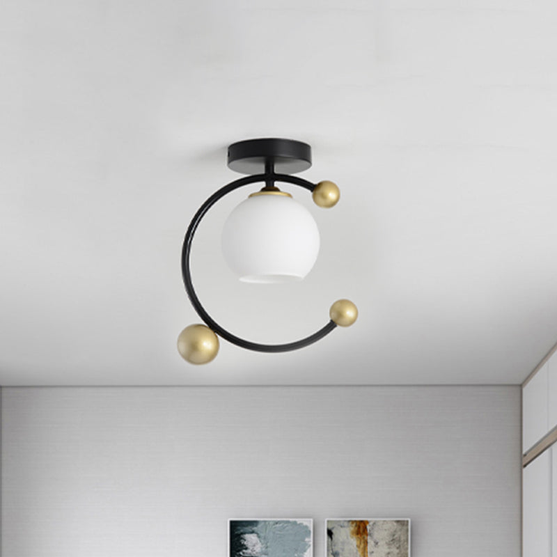 White Glass Sphere Semi Flush Mount Modernist 1 Light Black Semi Flush Mount Light Fixture with Iron Ring, 10"/12" Wide Clearhalo 'Ceiling Lights' 'Close To Ceiling Lights' 'Close to ceiling' 'Glass shade' 'Glass' 'Semi-flushmount' Lighting' 520843