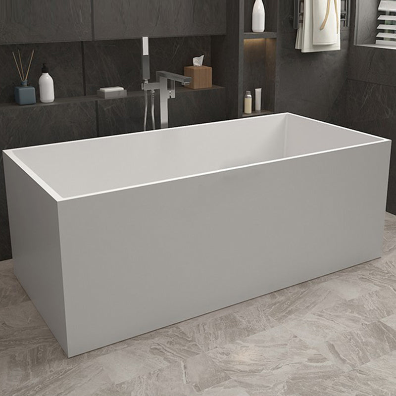 Modern Soaking Freestanding Bath Tub Stone Bathroom Bathtub with Overflow Trim White 63"L x 28"W x 22"H Clearhalo 'Bathroom Remodel & Bathroom Fixtures' 'Bathtubs' 'Home Improvement' 'home_improvement' 'home_improvement_bathtubs' 'Showers & Bathtubs' 6688966