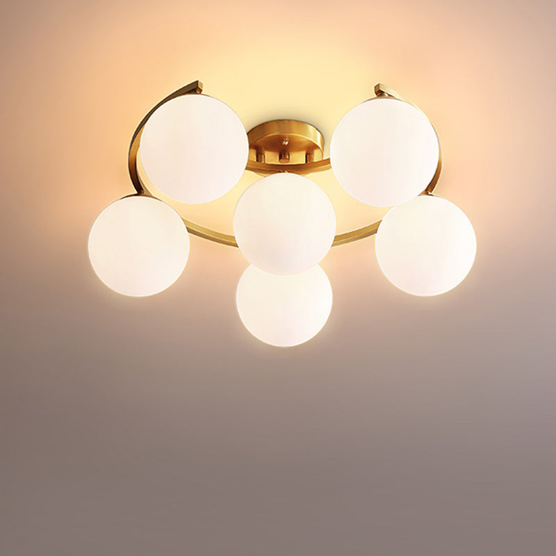 Gold Ball Semi Flushmount Modernist 3/6/8-Light Cream Glass LED Flush Mounted Lamp with Moon Design 6 Gold Clearhalo 'Ceiling Lights' 'Close To Ceiling Lights' 'Close to ceiling' 'Glass shade' 'Glass' 'Semi-flushmount' Lighting' 731125