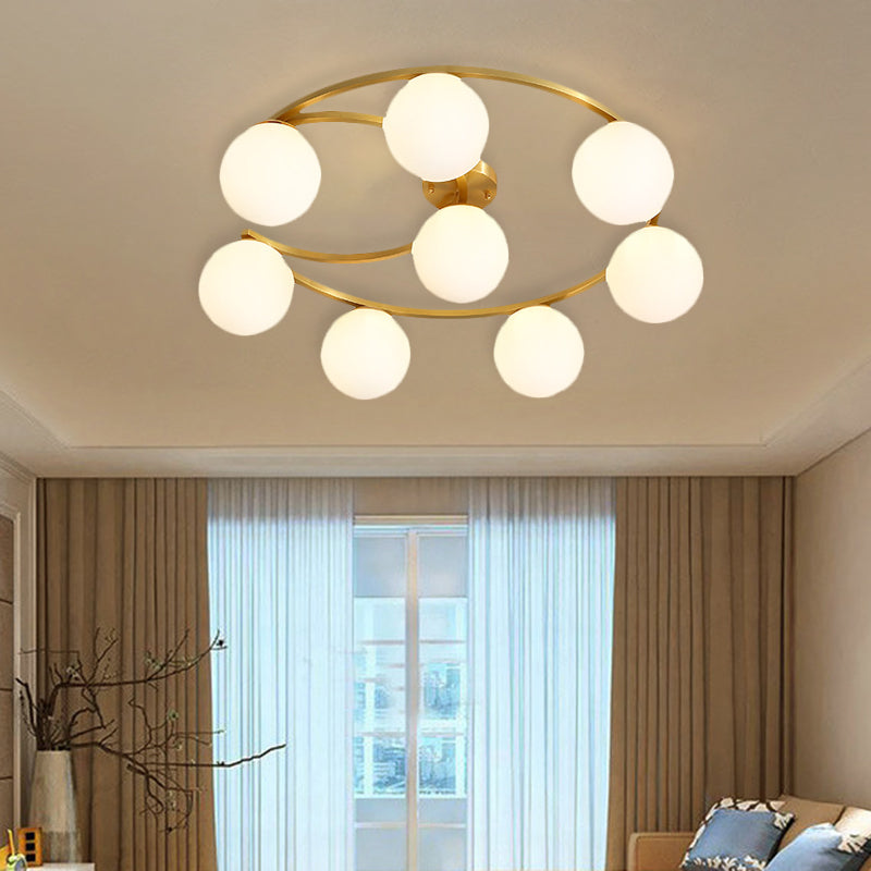 Gold Ball Semi Flushmount Modernist 3/6/8-Light Cream Glass LED Flush Mounted Lamp with Moon Design 8 Gold Clearhalo 'Ceiling Lights' 'Close To Ceiling Lights' 'Close to ceiling' 'Glass shade' 'Glass' 'Semi-flushmount' Lighting' 731134