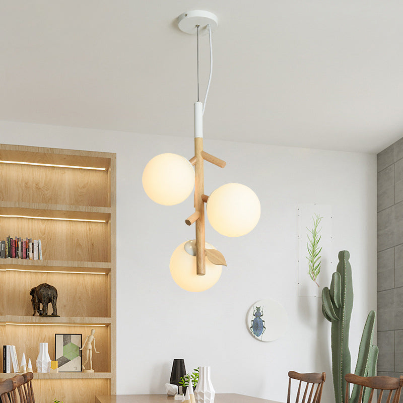 Modernist Ball Chandelier White Frosted Glass 2/3 Heads Dining Room Wood Ceiling Lamp with Vertical Branch Rod 3 White Clearhalo 'Ceiling Lights' 'Chandeliers' 'Glass shade' 'Glass' 'Modern Chandeliers' 'Modern' Lighting' 731209