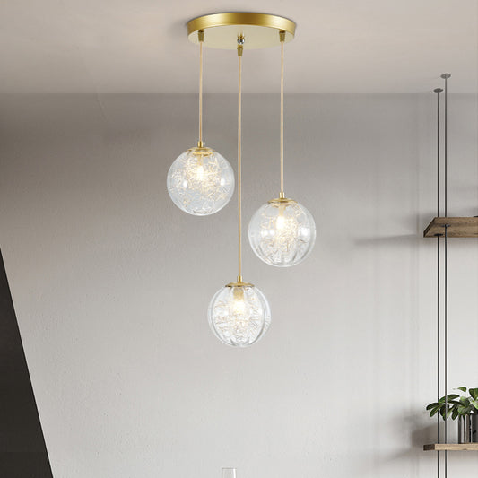 Minimalist Pumpkin Ball Multi Light Pendant Clear Glass 3 Lights Coffee House Hanging Lamp in Gold with Metal Line Deco Inside Gold Clearhalo 'Ceiling Lights' 'Glass shade' 'Glass' 'Modern Pendants' 'Modern' 'Pendant Lights' 'Pendants' Lighting' 731481