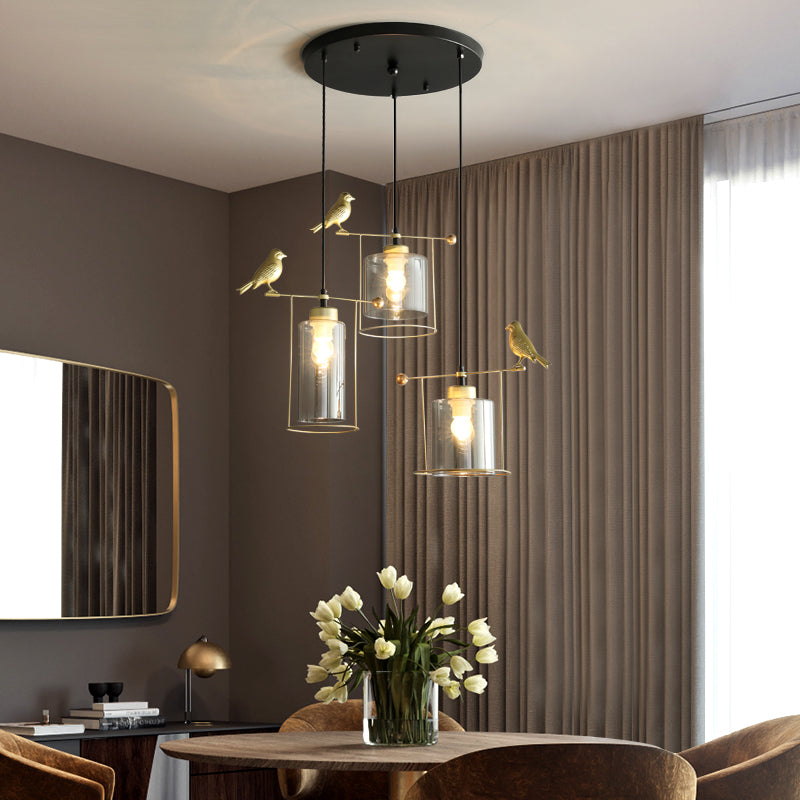 Cylinder Dining Room Cluster Pendant Cream/Smoke Gray Glass 3 Bulbs Modernism Suspension Lamp with Gold Bird Deco Clearhalo 'Ceiling Lights' 'Chandeliers' 'Glass shade' 'Glass' 'Modern Pendants' 'Modern' 'Pendant Lights' 'Pendants' Lighting' 731487