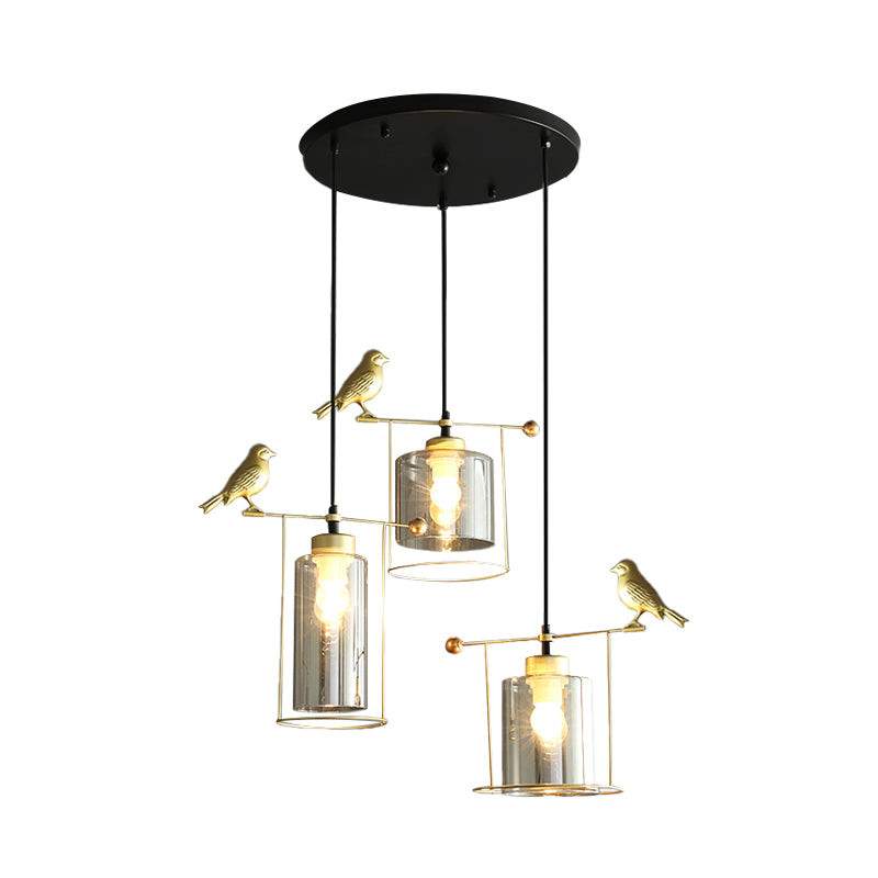 Cylinder Dining Room Cluster Pendant Cream/Smoke Gray Glass 3 Bulbs Modernism Suspension Lamp with Gold Bird Deco Clearhalo 'Ceiling Lights' 'Chandeliers' 'Glass shade' 'Glass' 'Modern Pendants' 'Modern' 'Pendant Lights' 'Pendants' Lighting' 731488