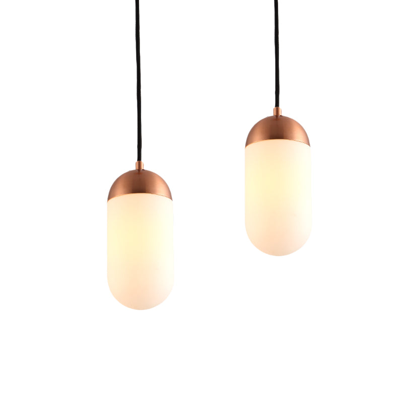 Post Modern Capsule Multi Ceiling Light White Glass 2 Lights Bedside Arced Pendant Lamp in Copper Clearhalo 'Ceiling Lights' 'Glass shade' 'Glass' 'Modern Pendants' 'Modern' 'Pendant Lights' 'Pendants' Lighting' 737157