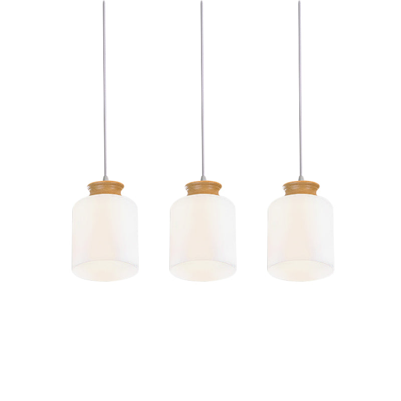 Cylinder Multi Light Chandelier Modern White Glass 3 Heads Wood Suspension Lamp with Round/Linear Canopy Clearhalo 'Ceiling Lights' 'Glass shade' 'Glass' 'Modern Pendants' 'Modern' 'Pendant Lights' 'Pendants' Lighting' 737161