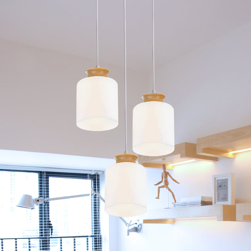 Cylinder Multi Light Chandelier Modern White Glass 3 Heads Wood Suspension Lamp with Round/Linear Canopy White Round Clearhalo 'Ceiling Lights' 'Glass shade' 'Glass' 'Modern Pendants' 'Modern' 'Pendant Lights' 'Pendants' Lighting' 737163