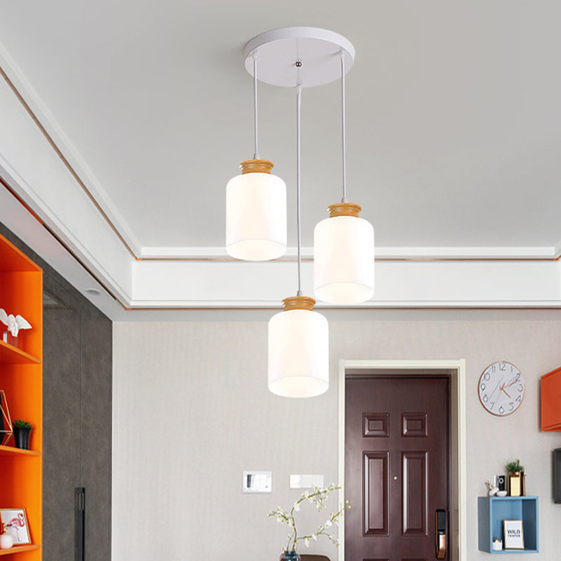 Cylinder Multi Light Chandelier Modern White Glass 3 Heads Wood Suspension Lamp with Round/Linear Canopy Clearhalo 'Ceiling Lights' 'Glass shade' 'Glass' 'Modern Pendants' 'Modern' 'Pendant Lights' 'Pendants' Lighting' 737164