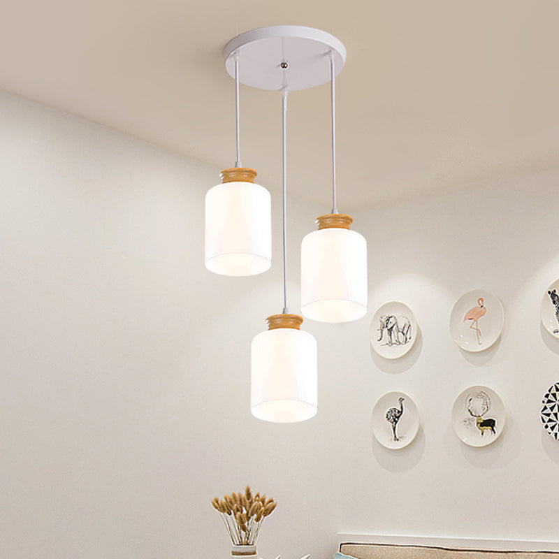 Cylinder Multi Light Chandelier Modern White Glass 3 Heads Wood Suspension Lamp with Round/Linear Canopy Clearhalo 'Ceiling Lights' 'Glass shade' 'Glass' 'Modern Pendants' 'Modern' 'Pendant Lights' 'Pendants' Lighting' 737165