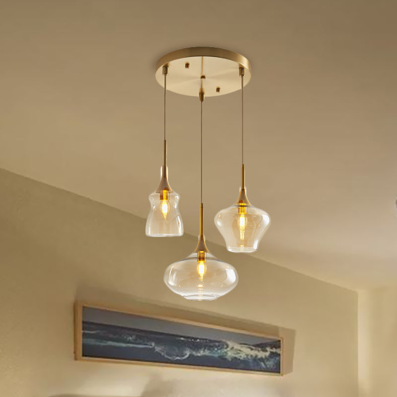 Clear/Cognac Glass Wavy Multi Ceiling Light Modernism 3 Bulbs Gold Hanging Pendant Lamp Clearhalo 'Ceiling Lights' 'Glass shade' 'Glass' 'Modern Pendants' 'Modern' 'Pendant Lights' 'Pendants' Lighting' 737182