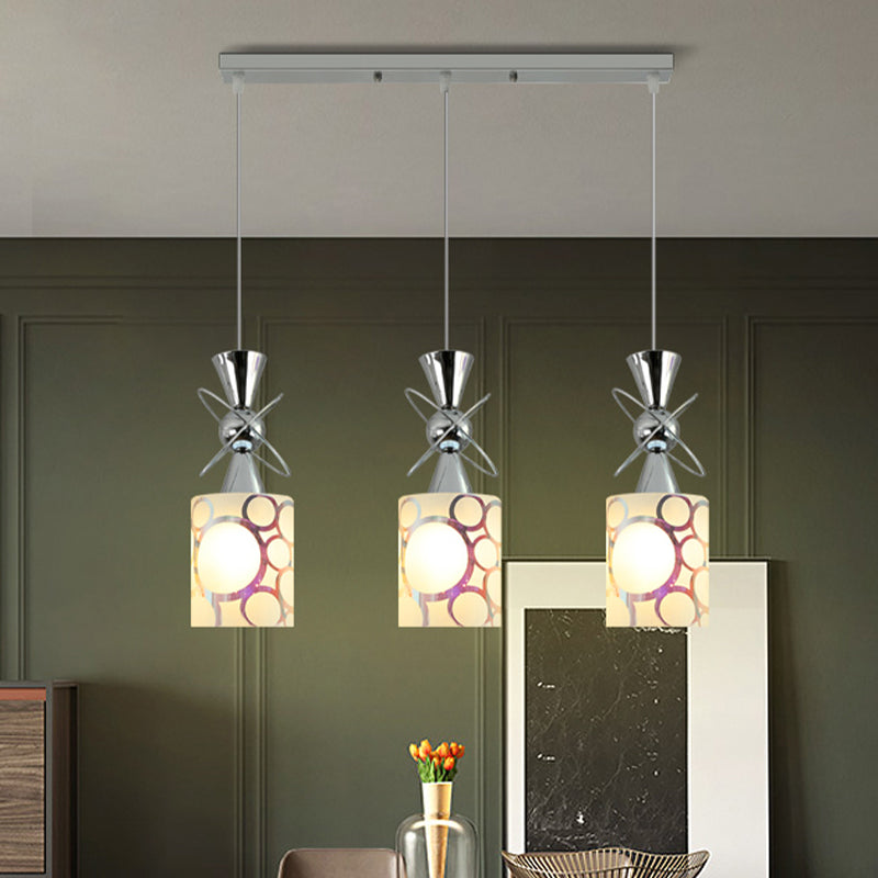 Metal Hourglass Multi Pendant Modernist 3-Bulb Chrome Ceiling Light with Cylinder Patterned Glass Shade, Linear/Round Canopy Clearhalo 'Ceiling Lights' 'Glass shade' 'Glass' 'Modern Pendants' 'Modern' 'Pendant Lights' 'Pendants' Lighting' 737193