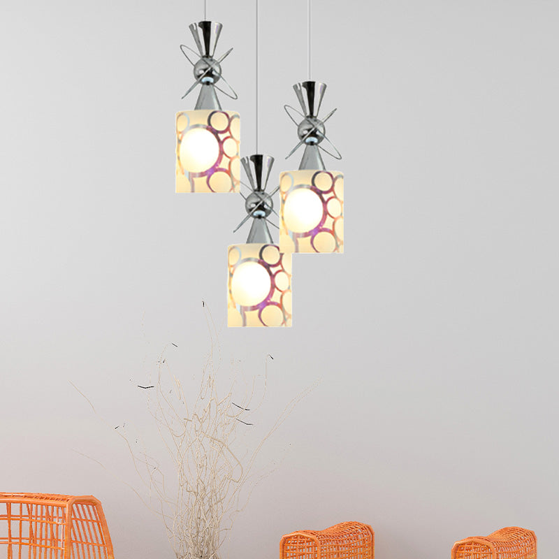 Metal Hourglass Multi Pendant Modernist 3-Bulb Chrome Ceiling Light with Cylinder Patterned Glass Shade, Linear/Round Canopy Chrome Round Clearhalo 'Ceiling Lights' 'Glass shade' 'Glass' 'Modern Pendants' 'Modern' 'Pendant Lights' 'Pendants' Lighting' 737198