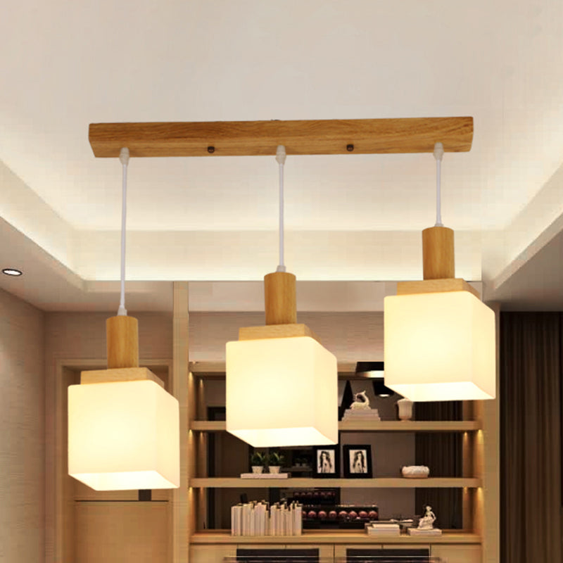 Wood Cube Multiple Hanging Light Modern 2/3 Heads Opal Glass Pendant Lamp Fixture with Linear Canopy Clearhalo 'Ceiling Lights' 'Glass shade' 'Glass' 'Modern Pendants' 'Modern' 'Pendant Lights' 'Pendants' Lighting' 738238