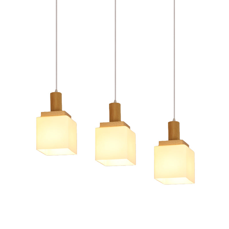 Wood Cube Multiple Hanging Light Modern 2/3 Heads Opal Glass Pendant Lamp Fixture with Linear Canopy Clearhalo 'Ceiling Lights' 'Glass shade' 'Glass' 'Modern Pendants' 'Modern' 'Pendant Lights' 'Pendants' Lighting' 738240