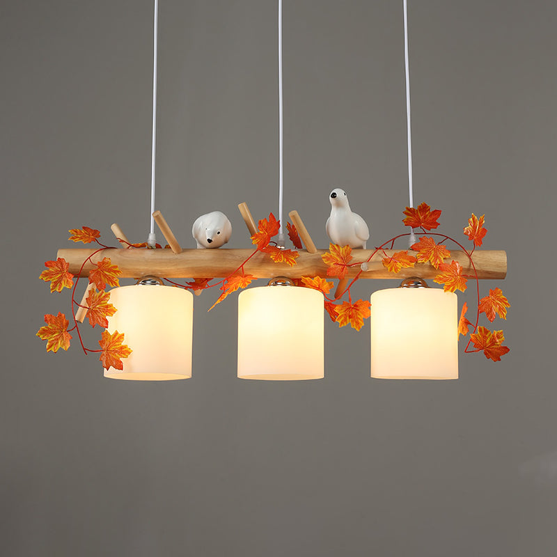 Ivory Glass Wood Island Light Cylinder 2/3 Bulbs Industrial Pendant Lamp with Maple/Green Leaf and Bird Decor Clearhalo 'Ceiling Lights' 'Close To Ceiling Lights' 'Glass shade' 'Glass' 'Island Lights' Lighting' 740394