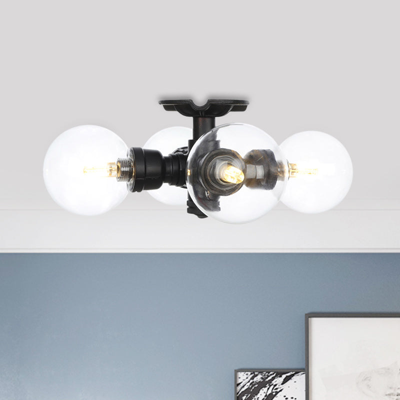 Industrial-Style Orb Semi Flush Light 3/4 Lights Clear Glass LED Flushmount Lamp in Black Clearhalo 'Ceiling Lights' 'Close To Ceiling Lights' 'Close to ceiling' 'Glass shade' 'Glass' 'Semi-flushmount' Lighting' 754129