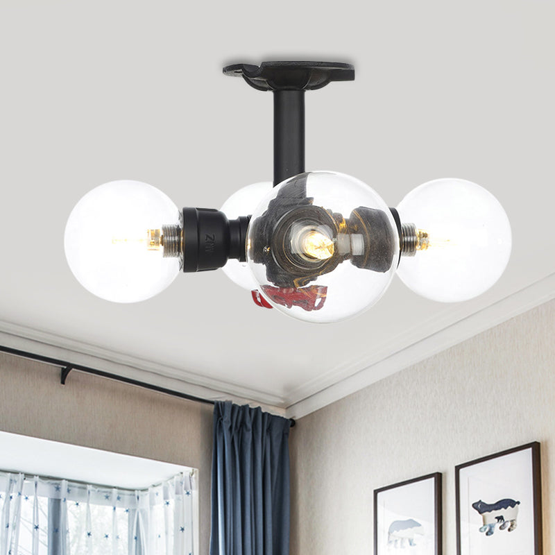 Industrial-Style Orb Semi Flush Light 3/4 Lights Clear Glass LED Flushmount Lamp in Black Clearhalo 'Ceiling Lights' 'Close To Ceiling Lights' 'Close to ceiling' 'Glass shade' 'Glass' 'Semi-flushmount' Lighting' 754134