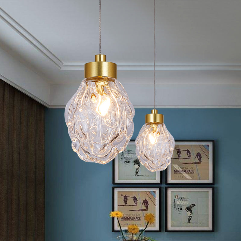 Post Modern Pineal Fruit Ceiling Light Clear Glass 1 Head Dining Room Suspension Pendant Lamp in Gold Clearhalo 'Ceiling Lights' 'Glass shade' 'Glass' 'Modern Pendants' 'Modern' 'Pendant Lights' 'Pendants' Lighting' 756988