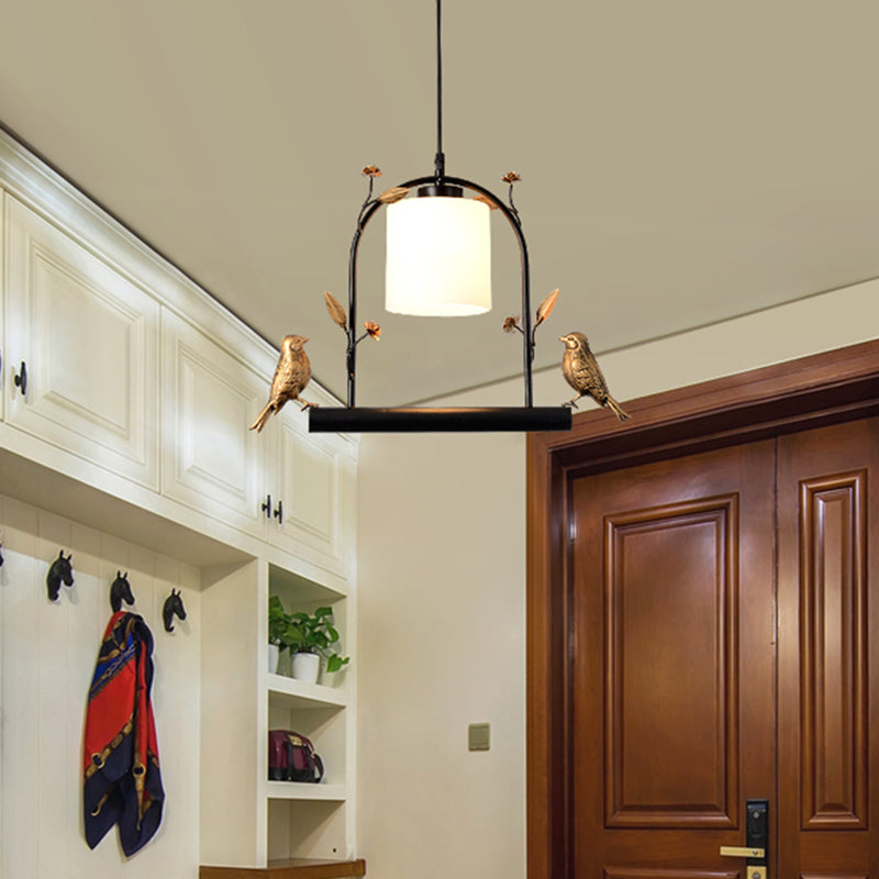 Birdcage Ceiling Light Modernist Metal 1-Head Black and Gold Hanging Pendant with Cylinder Cream Glass Shade and Bird Decor Black Clearhalo 'Ceiling Lights' 'Close To Ceiling Lights' 'Glass shade' 'Glass' 'Modern Pendants' 'Modern' 'Pendant Lights' 'Pendants' Lighting' 757100