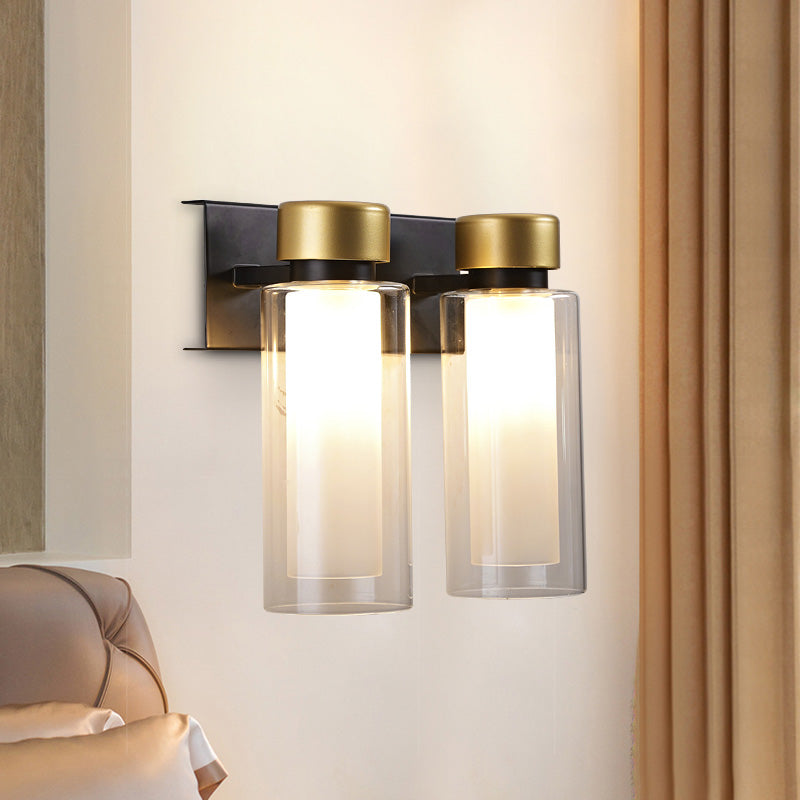 Brass Dual Cylinder Sconce Light Fixture Post-Modern 2 Bulbs Clear Glass LED Wall Mount Lamp Brass Clearhalo 'Cast Iron' 'Glass' 'Industrial' 'Modern wall lights' 'Modern' 'Tiffany' 'Traditional wall lights' 'Wall Lamps & Sconces' 'Wall Lights' Lighting' 758910