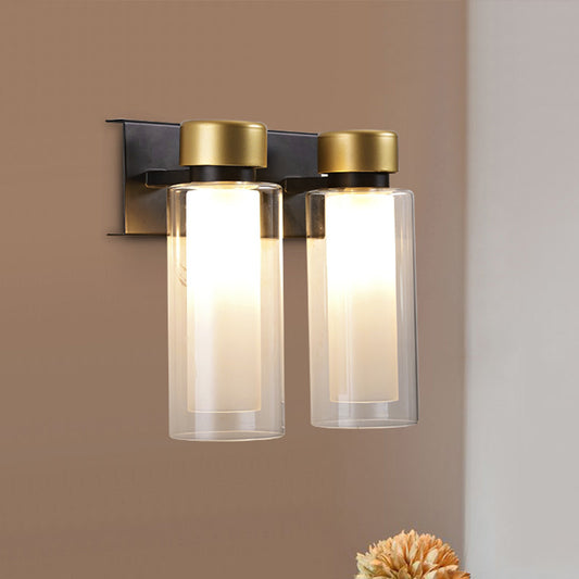 Brass Dual Cylinder Sconce Light Fixture Post-Modern 2 Bulbs Clear Glass LED Wall Mount Lamp Clearhalo 'Cast Iron' 'Glass' 'Industrial' 'Modern wall lights' 'Modern' 'Tiffany' 'Traditional wall lights' 'Wall Lamps & Sconces' 'Wall Lights' Lighting' 758911