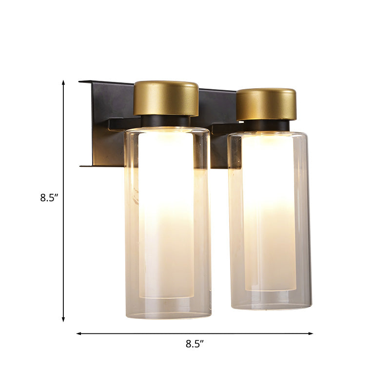 Brass Dual Cylinder Sconce Light Fixture Post-Modern 2 Bulbs Clear Glass LED Wall Mount Lamp Clearhalo 'Cast Iron' 'Glass' 'Industrial' 'Modern wall lights' 'Modern' 'Tiffany' 'Traditional wall lights' 'Wall Lamps & Sconces' 'Wall Lights' Lighting' 758913