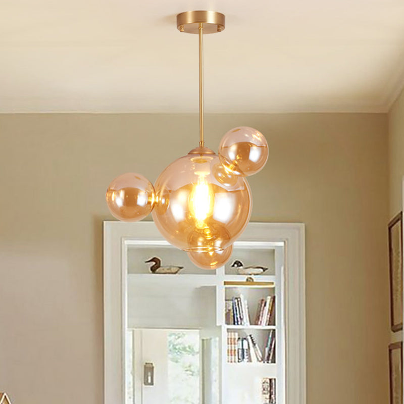 Amber Glass Bubble Shape Pendant Modernist 1 Light Hanging Lamp Kit over Dining Table Amber B Clearhalo 'Ceiling Lights' 'Close To Ceiling Lights' 'Glass shade' 'Glass' 'Modern Pendants' 'Modern' 'Pendant Lights' 'Pendants' Lighting' 759065