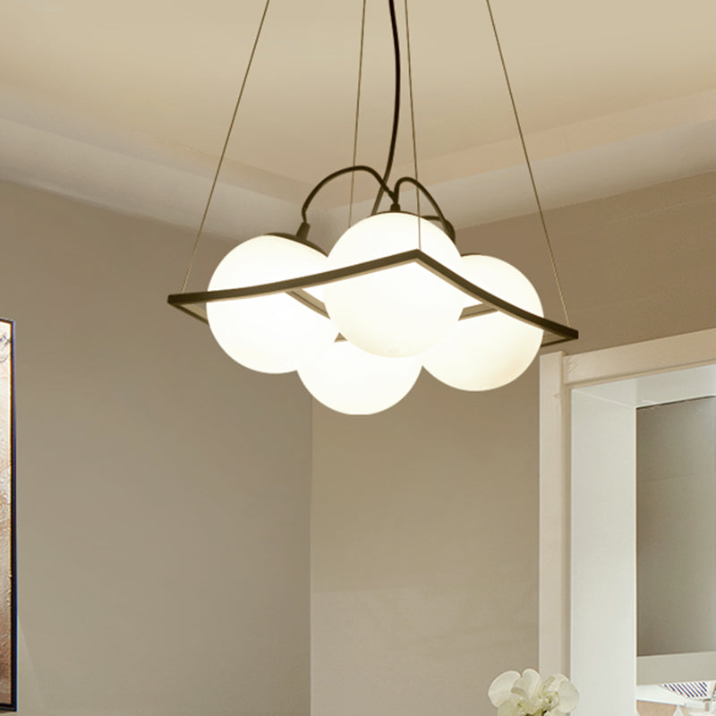 Globe Multi Light Pendant Modernist Frosted Glass 3/4 Lights Black Frame Ceiling Hang Fixture 4 Black Clearhalo 'Ceiling Lights' 'Modern Pendants' 'Modern' 'Pendant Lights' 'Pendants' Lighting' 759206