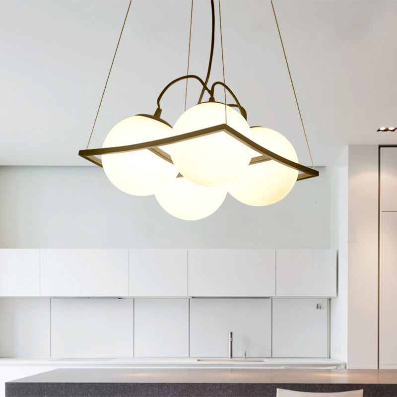 Globe Multi Light Pendant Modernist Frosted Glass 3/4 Lights Black Frame Ceiling Hang Fixture Clearhalo 'Ceiling Lights' 'Modern Pendants' 'Modern' 'Pendant Lights' 'Pendants' Lighting' 759208