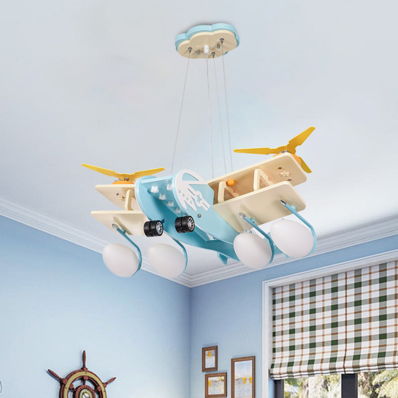 Kids Bomber Plane Wood Drop Lamp 4 Heads Chandelier Pendant Light in Light-Blue with Bomb White Glass Shade Light Blue Clearhalo 'Ceiling Lights' 'Chandeliers' Lighting' options 760387_18298ecf-9f00-4ea6-82c2-aaa012bbb4d5