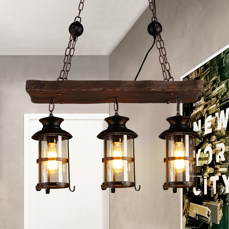 Clear Glass Lantern Island Pendant Light Industrial 2/3 Lights Bar Hanging Lamp in Black with Wood Decoration and Cage 3 Black Clearhalo 'Ceiling Lights' 'Island Lights' Lighting' 764342