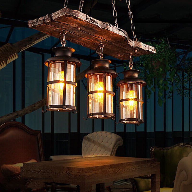 Clear Glass Lantern Island Pendant Light Industrial 2/3 Lights Bar Hanging Lamp in Black with Wood Decoration and Cage Clearhalo 'Ceiling Lights' 'Island Lights' Lighting' 764343