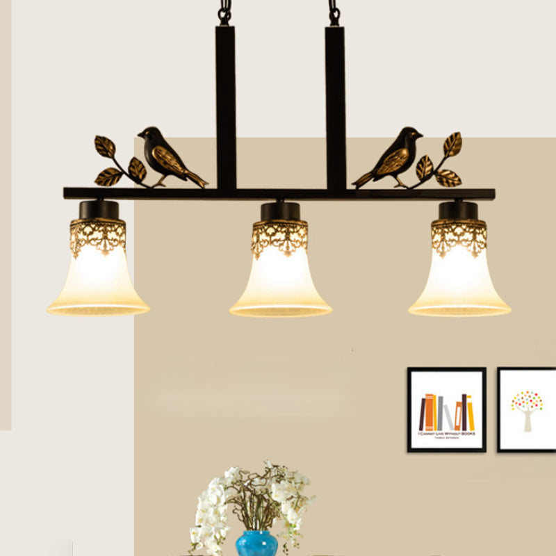 3 Heads Tan Glass Island Light Pendant Traditional Black Finish Bell Dining Room Ceiling Lamp with Bird Deco Black A Clearhalo 'Ceiling Lights' 'Island Lights' Lighting' 785450