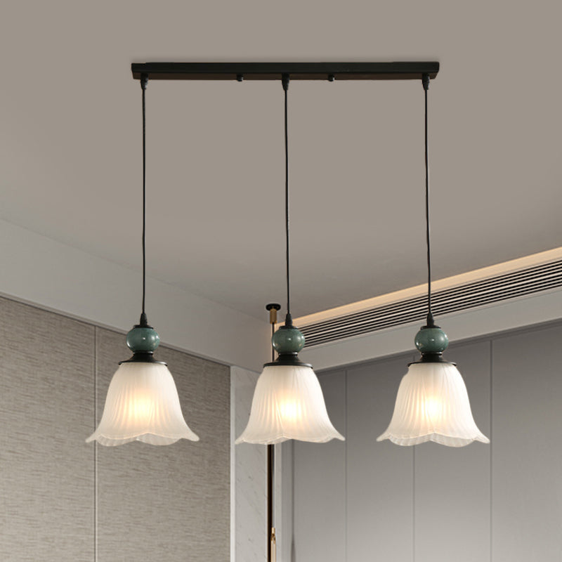 Frosted Ribbed Glass Flared Cluster Pendant Rustic 3 Lights Dining Room Hanging Lamp Kit in Black with Round/Linear Canopy Black Linear Clearhalo 'Ceiling Lights' 'Pendant Lights' 'Pendants' Lighting' 785711_7d9c4f33-875e-4d68-a845-416fb72b9646