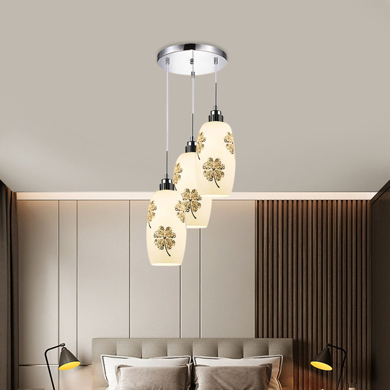 White Frosted Glass Bottle Multi-Pendant Minimalist 3 Lights Restaurant Hanging Ceiling Lamp with Clover Pattern Clearhalo 'Ceiling Lights' 'Glass shade' 'Glass' 'Pendant Lights' 'Pendants' Lighting' 800756