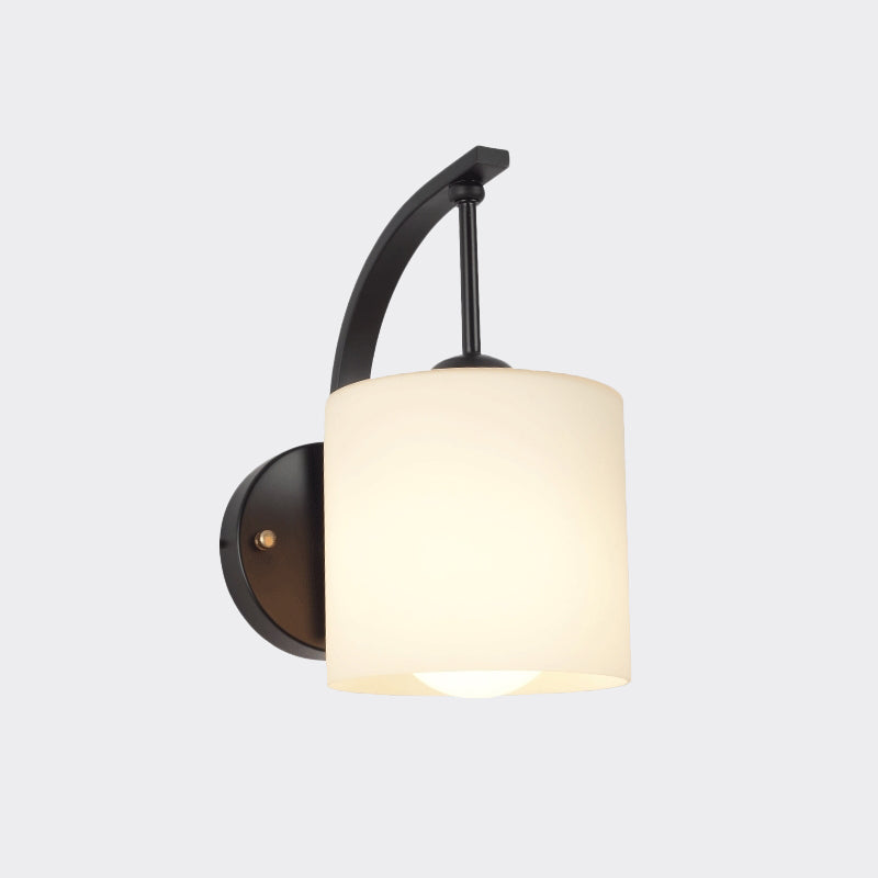Modernism 1-Light Wall Sconce Black Finish Cylindrical Wall Lamp Fixture with Opal Glass Shade Clearhalo 'Cast Iron' 'Glass' 'Industrial' 'Modern wall lights' 'Modern' 'Tiffany' 'Traditional wall lights' 'Wall Lamps & Sconces' 'Wall Lights' Lighting' 800875