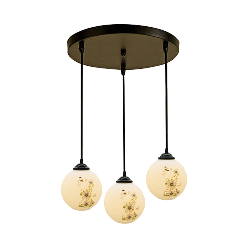 Black Sphere Multi Ceiling Lamp Modernism White Printing Glass 3-Light Dining Room Pendant with Round/Linear Canopy Clearhalo 'Ceiling Lights' 'Close To Ceiling Lights' 'Glass shade' 'Glass' 'Pendant Lights' 'Pendants' Lighting' 802327