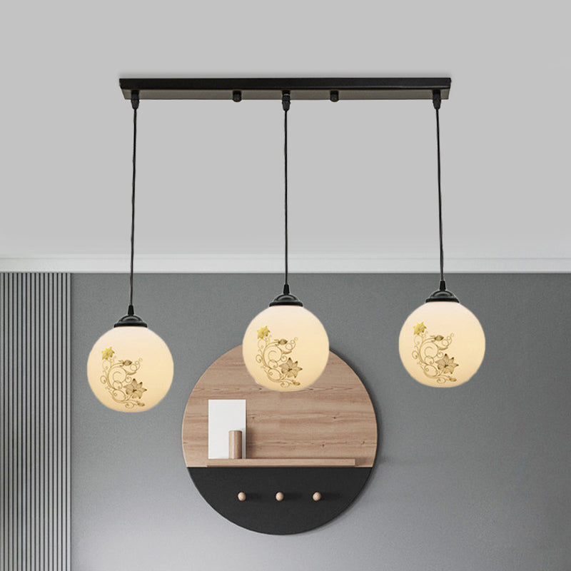 Black Sphere Multi Ceiling Lamp Modernism White Printing Glass 3-Light Dining Room Pendant with Round/Linear Canopy Clearhalo 'Ceiling Lights' 'Close To Ceiling Lights' 'Glass shade' 'Glass' 'Pendant Lights' 'Pendants' Lighting' 802329