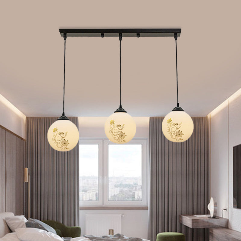 Black Sphere Multi Ceiling Lamp Modernism White Printing Glass 3-Light Dining Room Pendant with Round/Linear Canopy Clearhalo 'Ceiling Lights' 'Close To Ceiling Lights' 'Glass shade' 'Glass' 'Pendant Lights' 'Pendants' Lighting' 802330