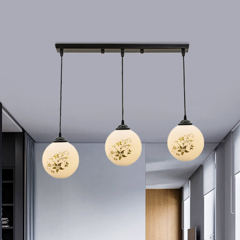 Black Sphere Multi Ceiling Lamp Modernism White Printing Glass 3-Light Dining Room Pendant with Round/Linear Canopy Clearhalo 'Ceiling Lights' 'Close To Ceiling Lights' 'Glass shade' 'Glass' 'Pendant Lights' 'Pendants' Lighting' 802334