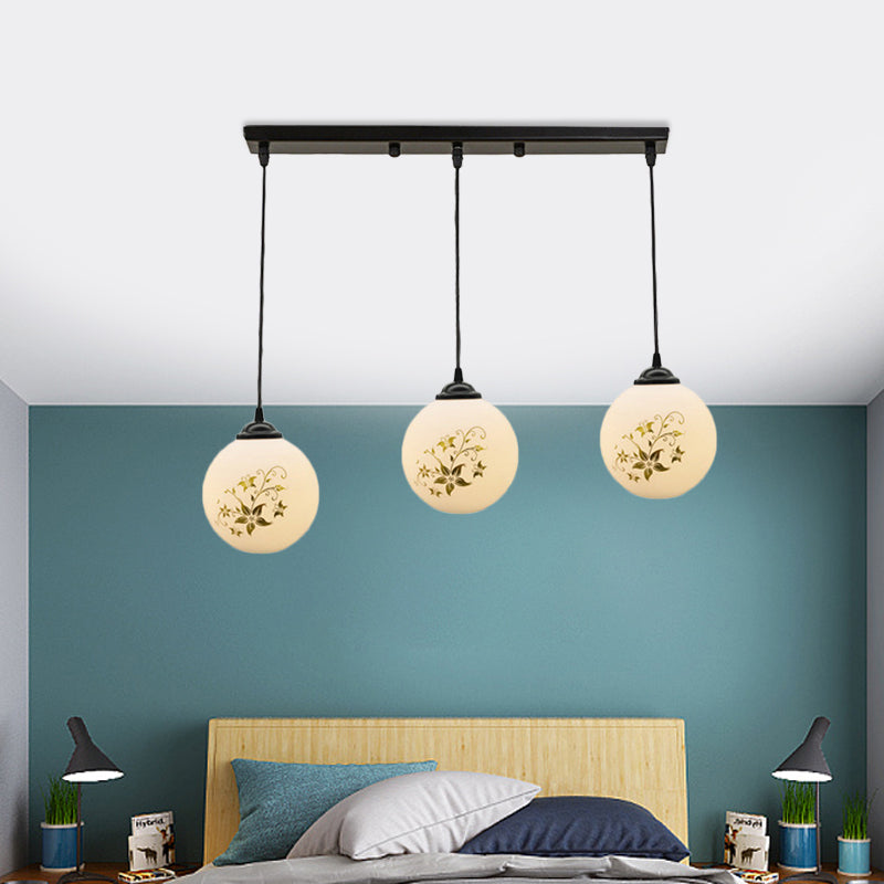 Black Sphere Multi Ceiling Lamp Modernism White Printing Glass 3-Light Dining Room Pendant with Round/Linear Canopy Clearhalo 'Ceiling Lights' 'Close To Ceiling Lights' 'Glass shade' 'Glass' 'Pendant Lights' 'Pendants' Lighting' 802335