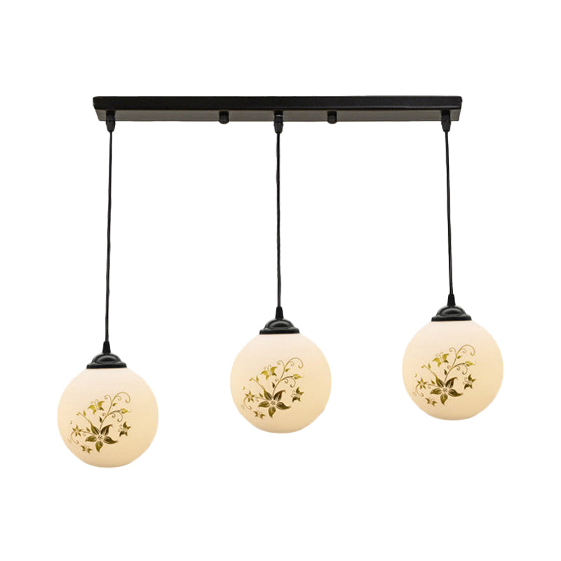 Black Sphere Multi Ceiling Lamp Modernism White Printing Glass 3-Light Dining Room Pendant with Round/Linear Canopy Clearhalo 'Ceiling Lights' 'Close To Ceiling Lights' 'Glass shade' 'Glass' 'Pendant Lights' 'Pendants' Lighting' 802336