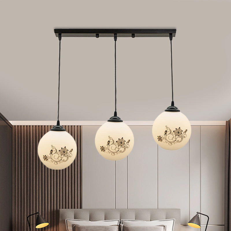 Black Sphere Multi Ceiling Lamp Modernism White Printing Glass 3-Light Dining Room Pendant with Round/Linear Canopy Clearhalo 'Ceiling Lights' 'Close To Ceiling Lights' 'Glass shade' 'Glass' 'Pendant Lights' 'Pendants' Lighting' 802338
