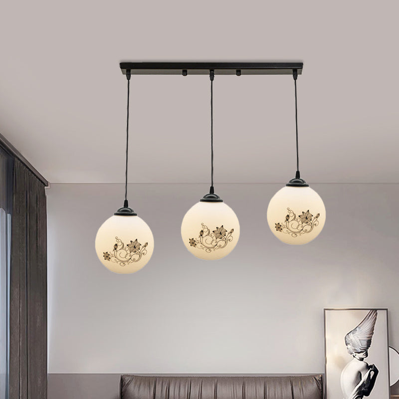Black Sphere Multi Ceiling Lamp Modernism White Printing Glass 3-Light Dining Room Pendant with Round/Linear Canopy Clearhalo 'Ceiling Lights' 'Close To Ceiling Lights' 'Glass shade' 'Glass' 'Pendant Lights' 'Pendants' Lighting' 802339