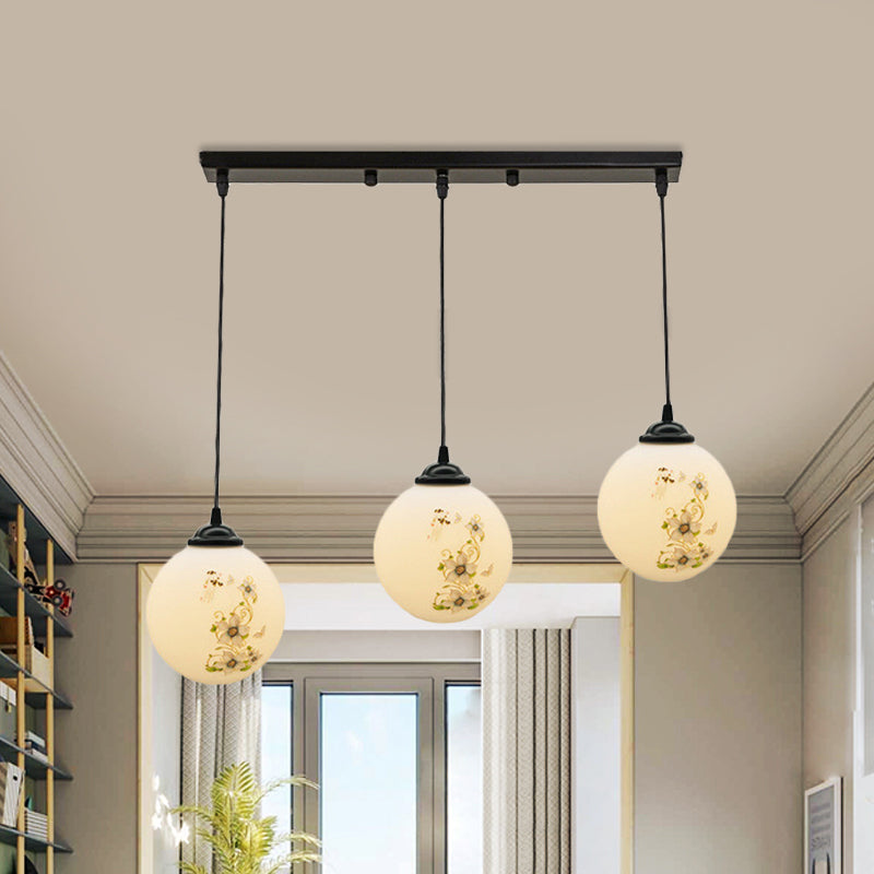 Black Sphere Multi Ceiling Lamp Modernism White Printing Glass 3-Light Dining Room Pendant with Round/Linear Canopy Clearhalo 'Ceiling Lights' 'Close To Ceiling Lights' 'Glass shade' 'Glass' 'Pendant Lights' 'Pendants' Lighting' 802342