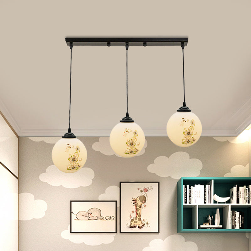 Black Sphere Multi Ceiling Lamp Modernism White Printing Glass 3-Light Dining Room Pendant with Round/Linear Canopy Clearhalo 'Ceiling Lights' 'Close To Ceiling Lights' 'Glass shade' 'Glass' 'Pendant Lights' 'Pendants' Lighting' 802343